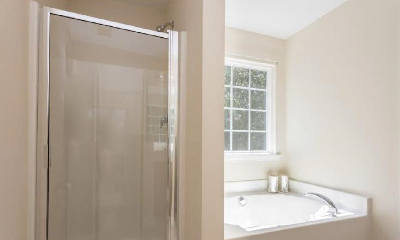 3128 Binghampton Lane Raleigh, NC 27604 - Photo 6 of 9 a bathroom with a sink and a bathtub