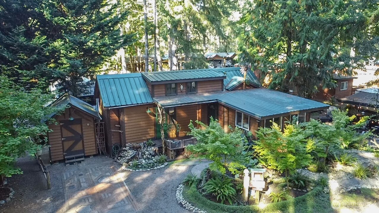 a wooden house with lots of trees