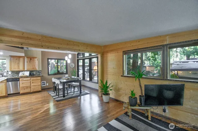 a living room with furniture fireplace and flat screen tv