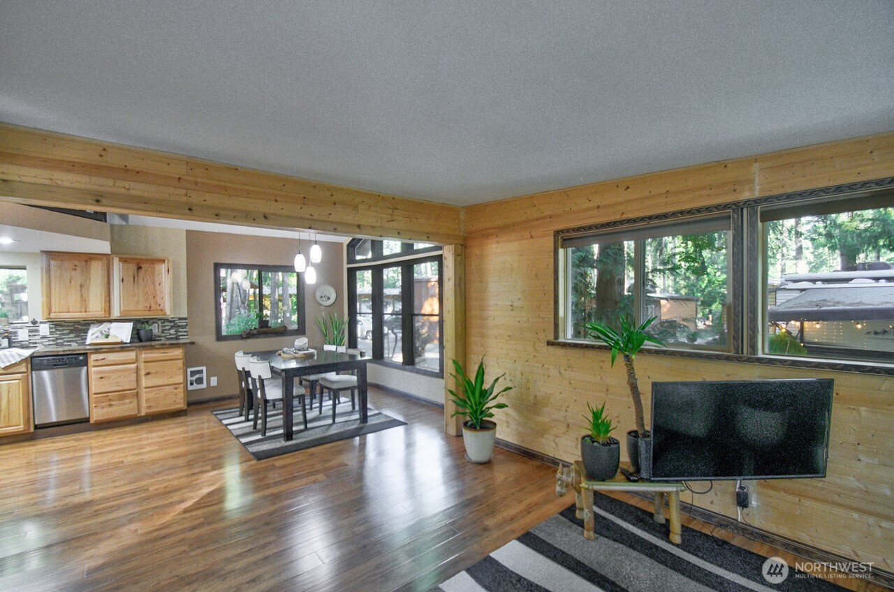 1546 Reservation Road Southeast, Unit 183 Olympia, WA 98513 - Photo 12 of 38 a living room with furniture fireplace and flat screen tv