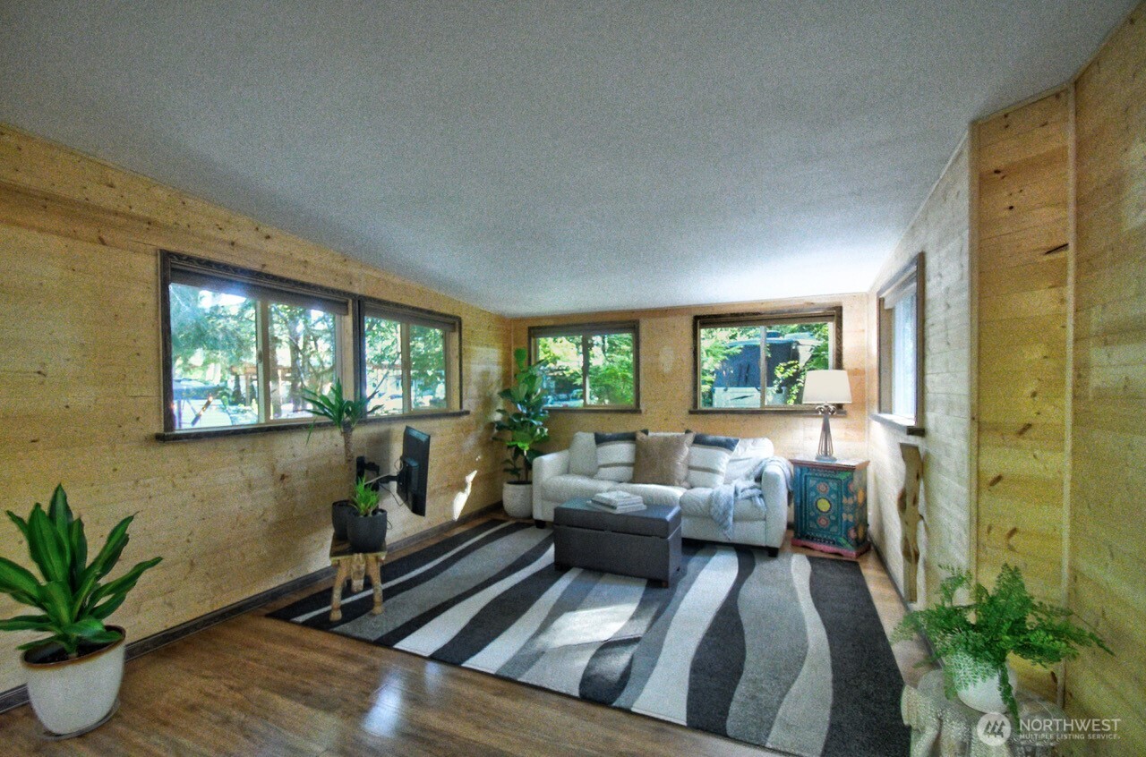 1546 Reservation Road Southeast, Unit 183 Olympia, WA 98513 - Photo 13 of 38 a living room with furniture and a potted plant
