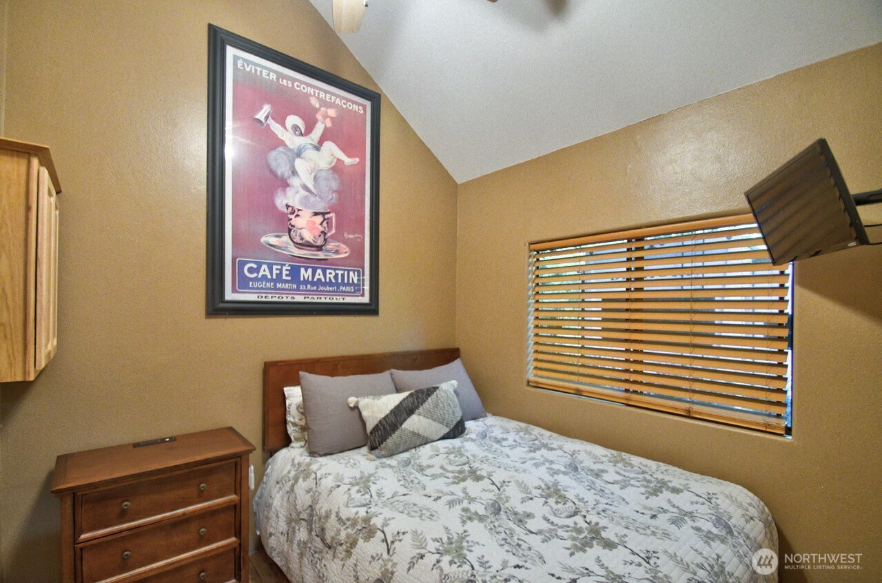 1546 Reservation Road Southeast, Unit 183 Olympia, WA 98513 - Photo 14 of 38 a bed sitting in a bedroom next to a window