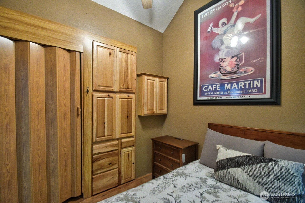 1546 Reservation Road Southeast, Unit 183 Olympia, WA 98513 - Photo 15 of 38 a bedroom with a bed and furniture