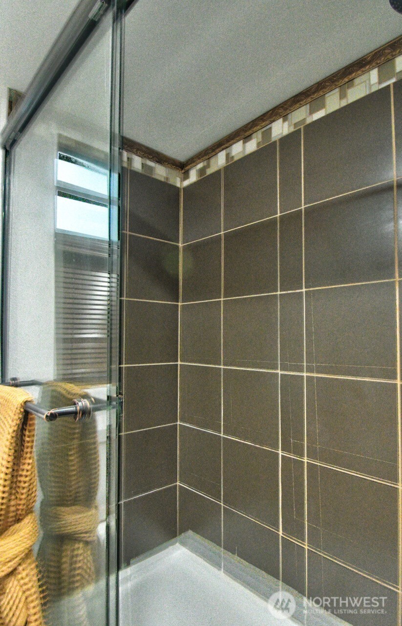 1546 Reservation Road Southeast, Unit 183 Olympia, WA 98513 - Photo 18 of 38 a bathroom with a shower