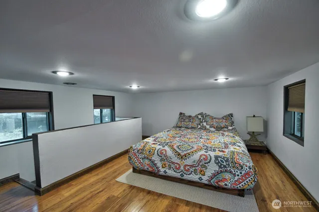 a bedroom with a large bed and a couch