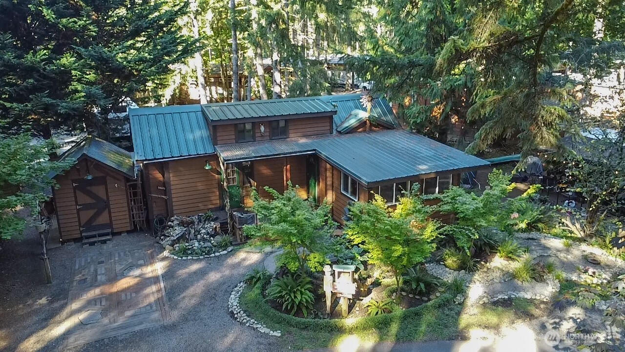 1546 Reservation Road Southeast, Unit 183 Olympia, WA 98513 - Photo 21 of 38 a view of a house with a yard and large tree