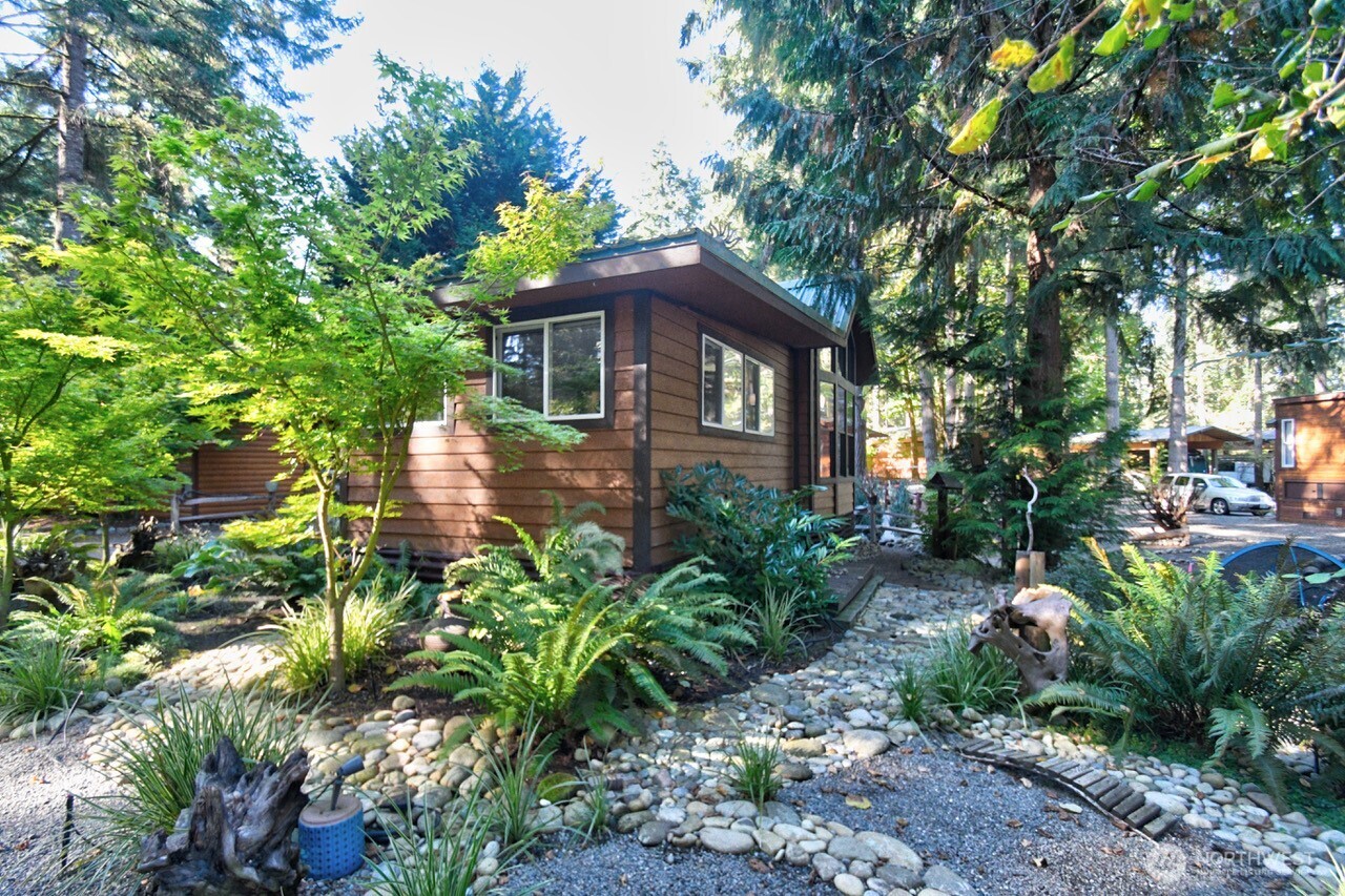 1546 Reservation Road Southeast, Unit 183 Olympia, WA 98513 - Photo 23 of 38 a front view of a house with a yard