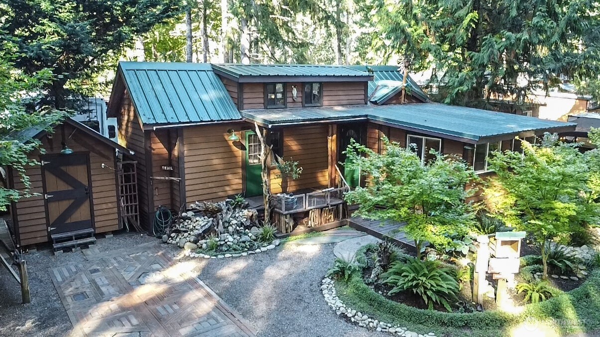 1546 Reservation Road Southeast, Unit 183 Olympia, WA 98513 - Photo 3 of 38 a front view of a house with garden