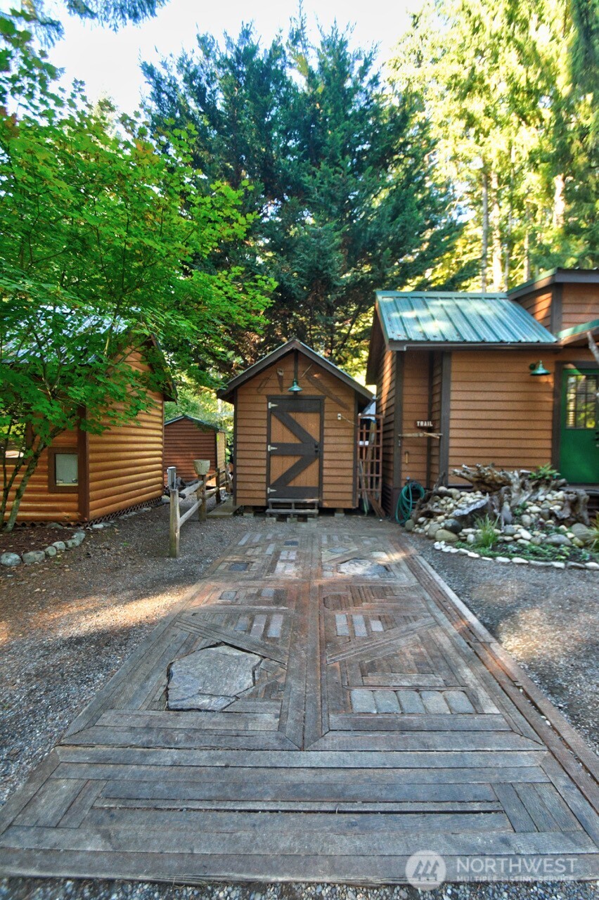 1546 Reservation Road Southeast, Unit 183 Olympia, WA 98513 - Photo 4 of 38 a front view of a house with a yard and garage