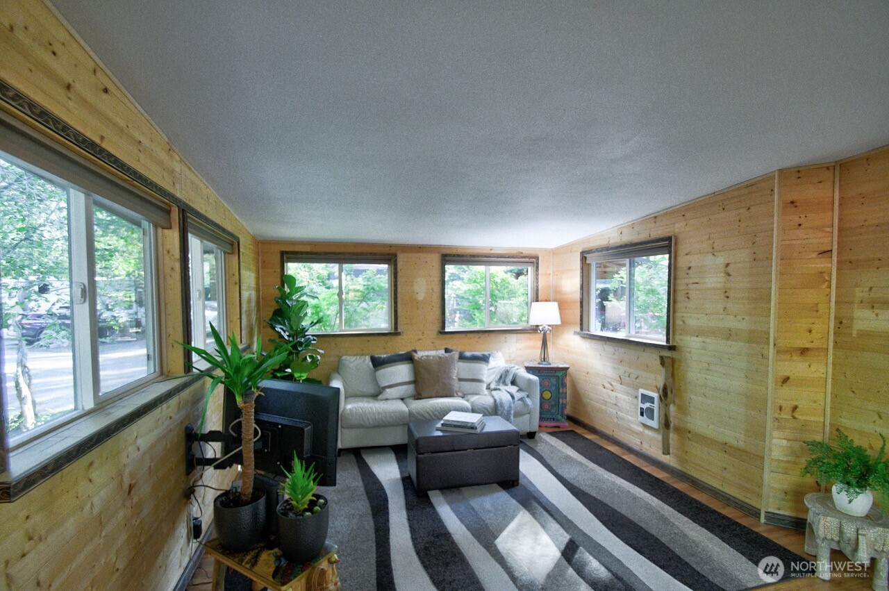 1546 Reservation Road Southeast, Unit 183 Olympia, WA 98513 - Photo 8 of 38 a living room with furniture and a potted plant
