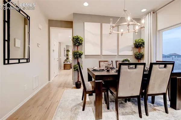 a dining room with furniture and window