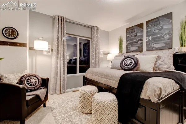 a bedroom with a bed and a dresser