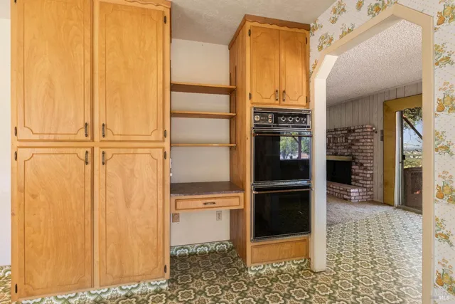 a view of bathroom with a shower and mirror