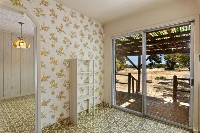 a view of livingroom with furniture and floor to ceiling window