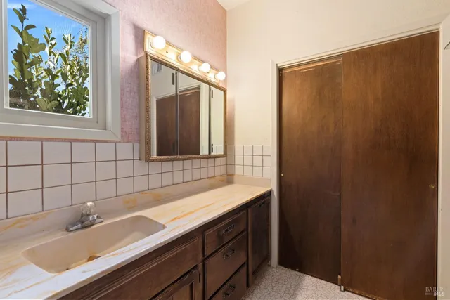 a bathroom with a toilet sink and shower