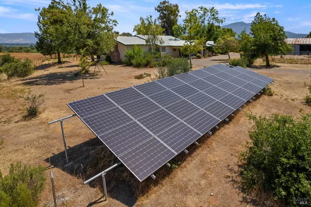 a view of a terrace with a garden and mountain view