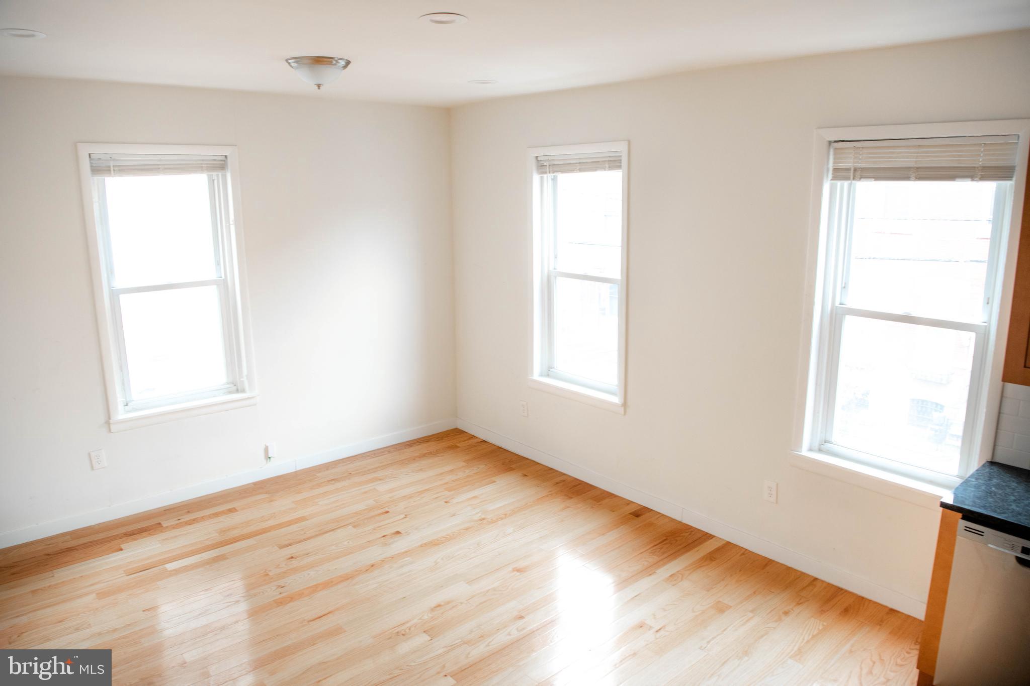 767 South 15th Street Philadelphia, PA 19146 - Photo 33 of 69 a view of an empty room with wooden floor and a window
