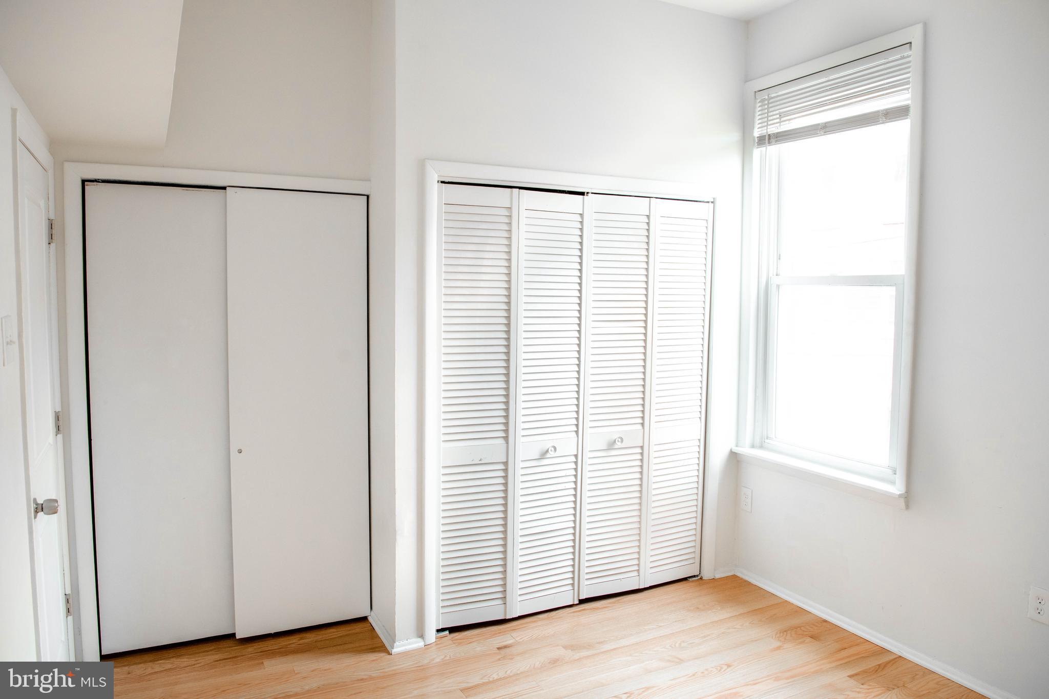 767 South 15th Street Philadelphia, PA 19146 - Photo 36 of 69 an empty room with wooden floor and entrance