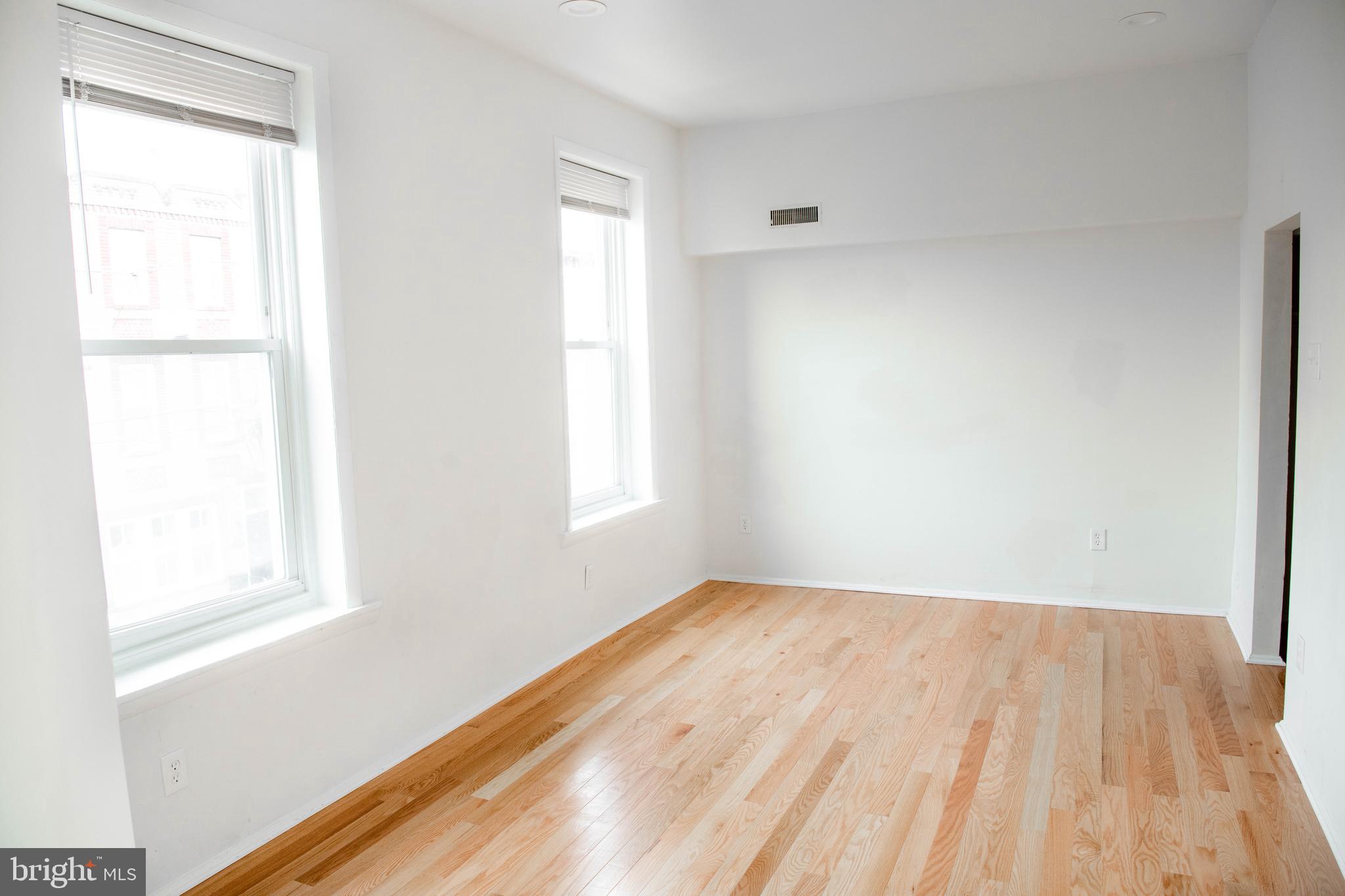767 South 15th Street Philadelphia, PA 19146 - Photo 39 of 69 a view of an empty room with wooden floor and a window