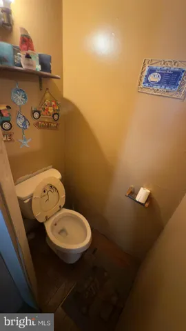 a bathroom with a toilet and a sink