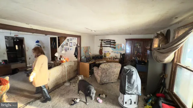 a view of a livingroom with furniture and workspace