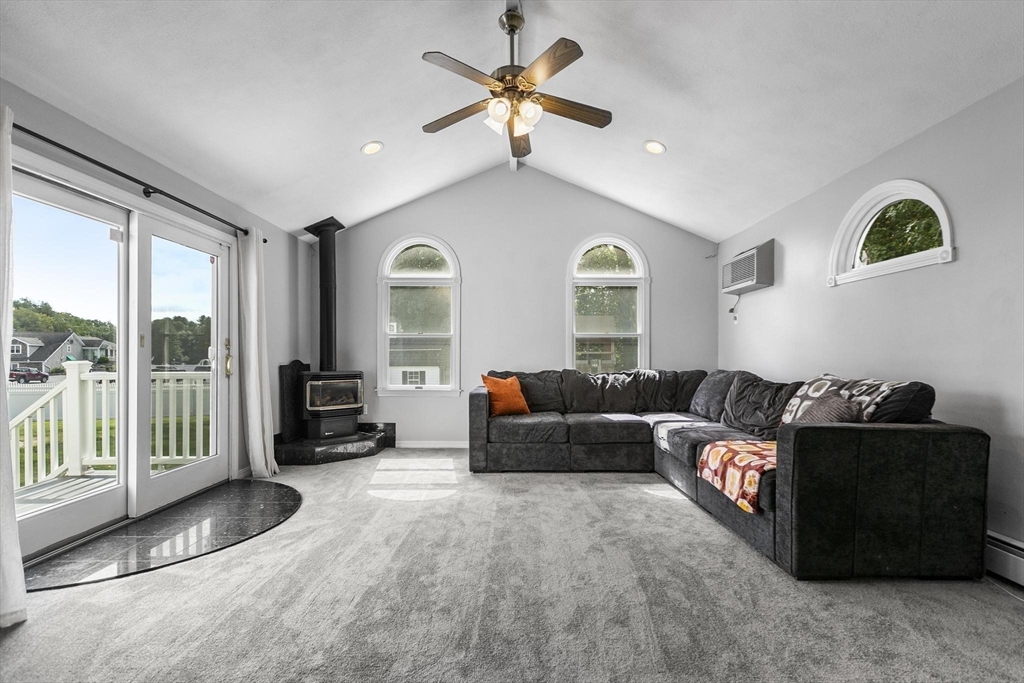 49 Baldwin Road Billerica, MA 01821 - Photo 14 of 42 a living room with furniture and large windows