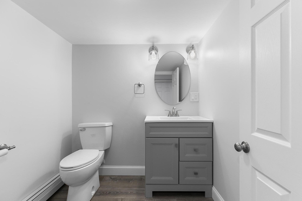 49 Baldwin Road Billerica, MA 01821 - Photo 27 of 42 a bathroom with a toilet a sink and mirror