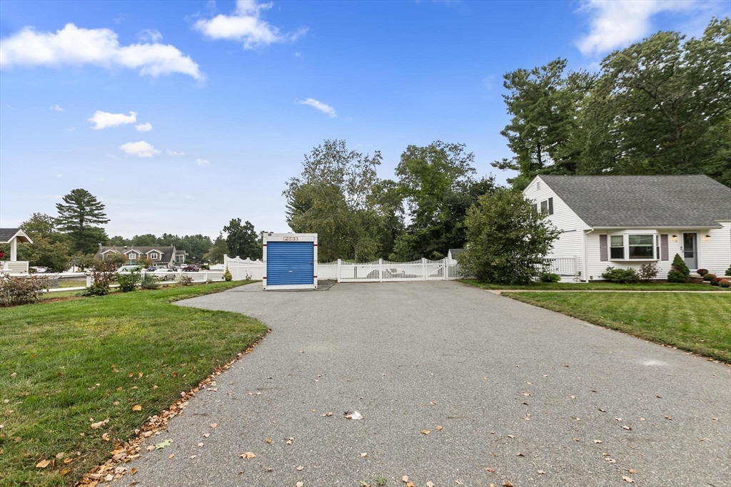 49 Baldwin Road Billerica, MA 01821 - Photo 3 of 42 a front view of a house with a yard and garage