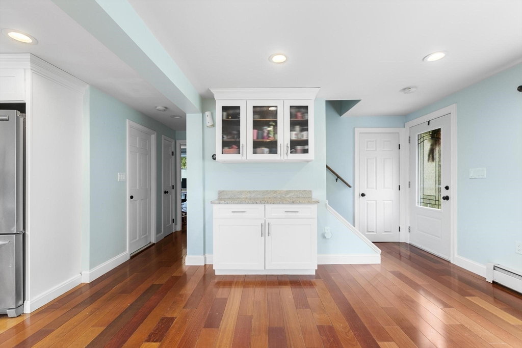 49 Baldwin Road Billerica, MA 01821 - Photo 5 of 42 wooden floor in an empty room with a window