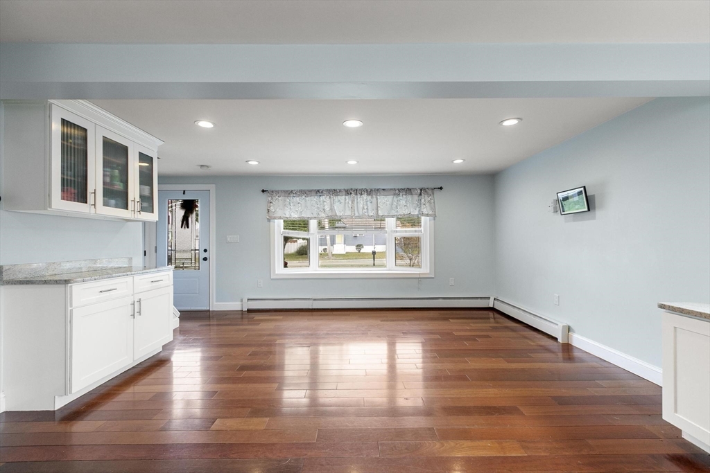 49 Baldwin Road Billerica, MA 01821 - Photo 7 of 42 a view of an empty room with wooden floor and a window