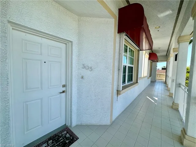 a view of entryway and hall with a window