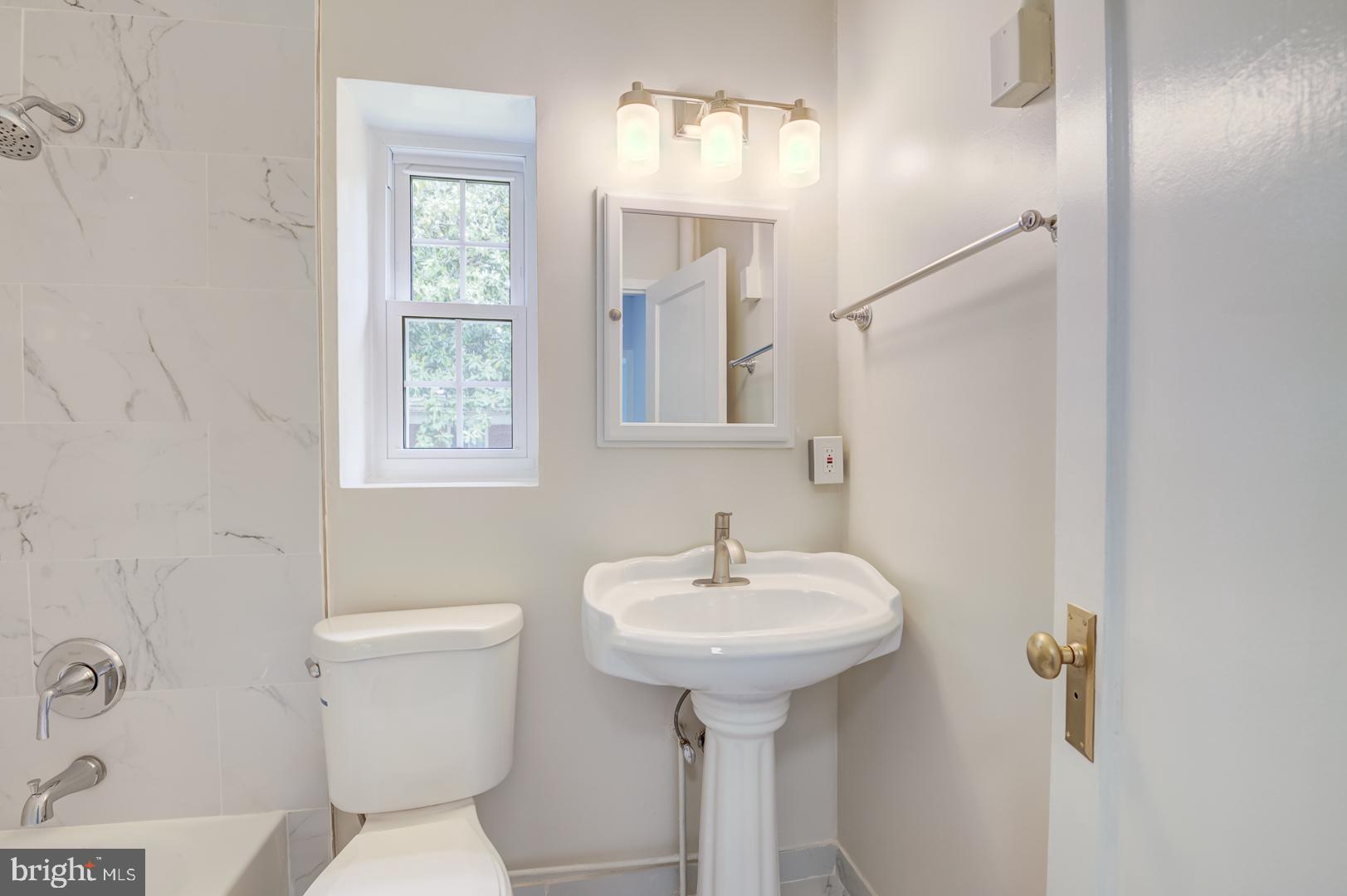 1628 Mt Eagle Place Alexandria, VA 22302 - Photo 12 of 41 a bathroom with a sink toilet and mirror