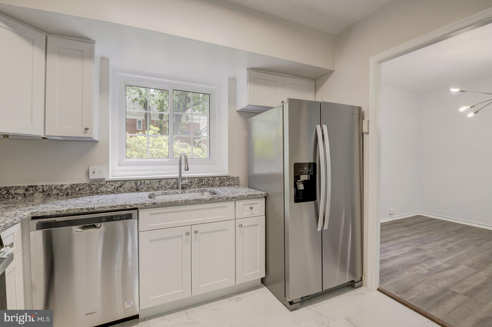 1628 Mt Eagle Place Alexandria, VA 22302 - Photo 25 of 41 a kitchen with stainless steel appliances granite countertop a refrigerator and a stove
