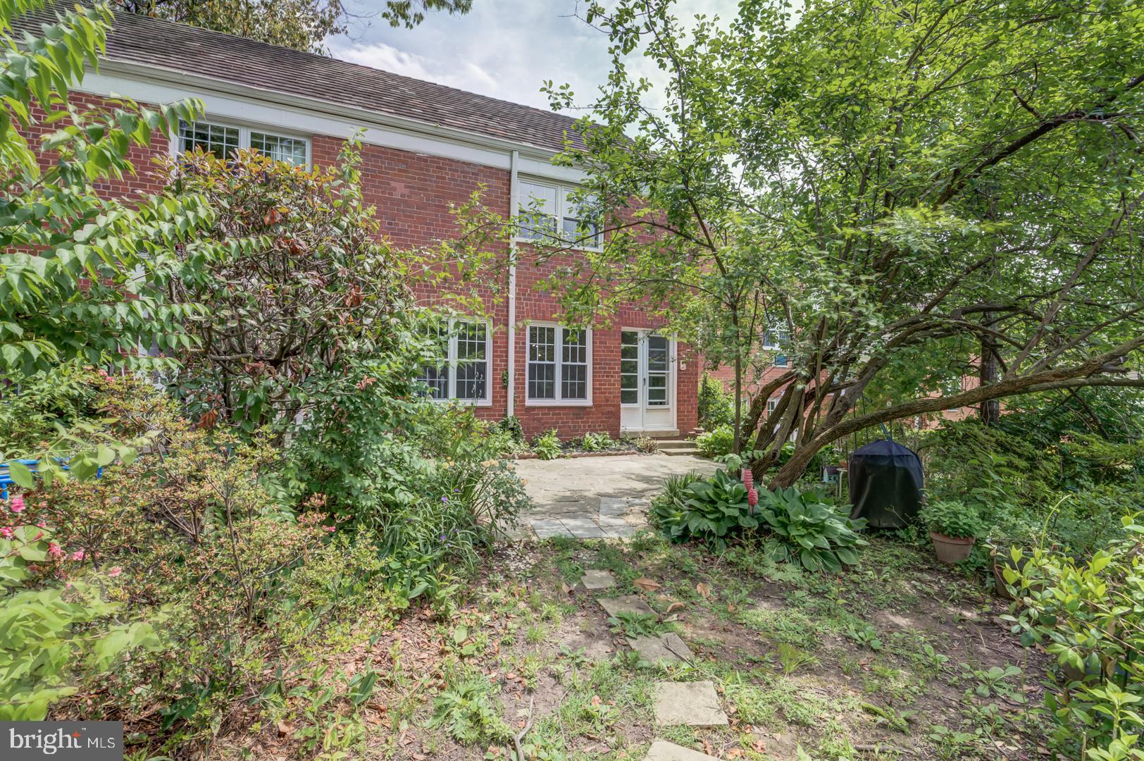 1628 Mt Eagle Place Alexandria, VA 22302 - Photo 39 of 41 a view of a house with brick walls and plants