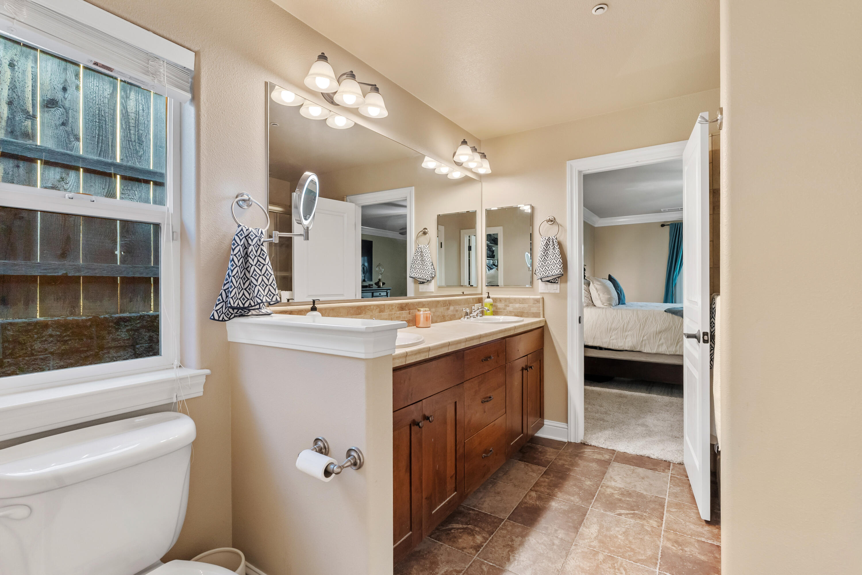 3149 Laver Street Redding, CA 96002 - Photo 23 of 40 a bathroom with a double vanity sink mirror and toilet