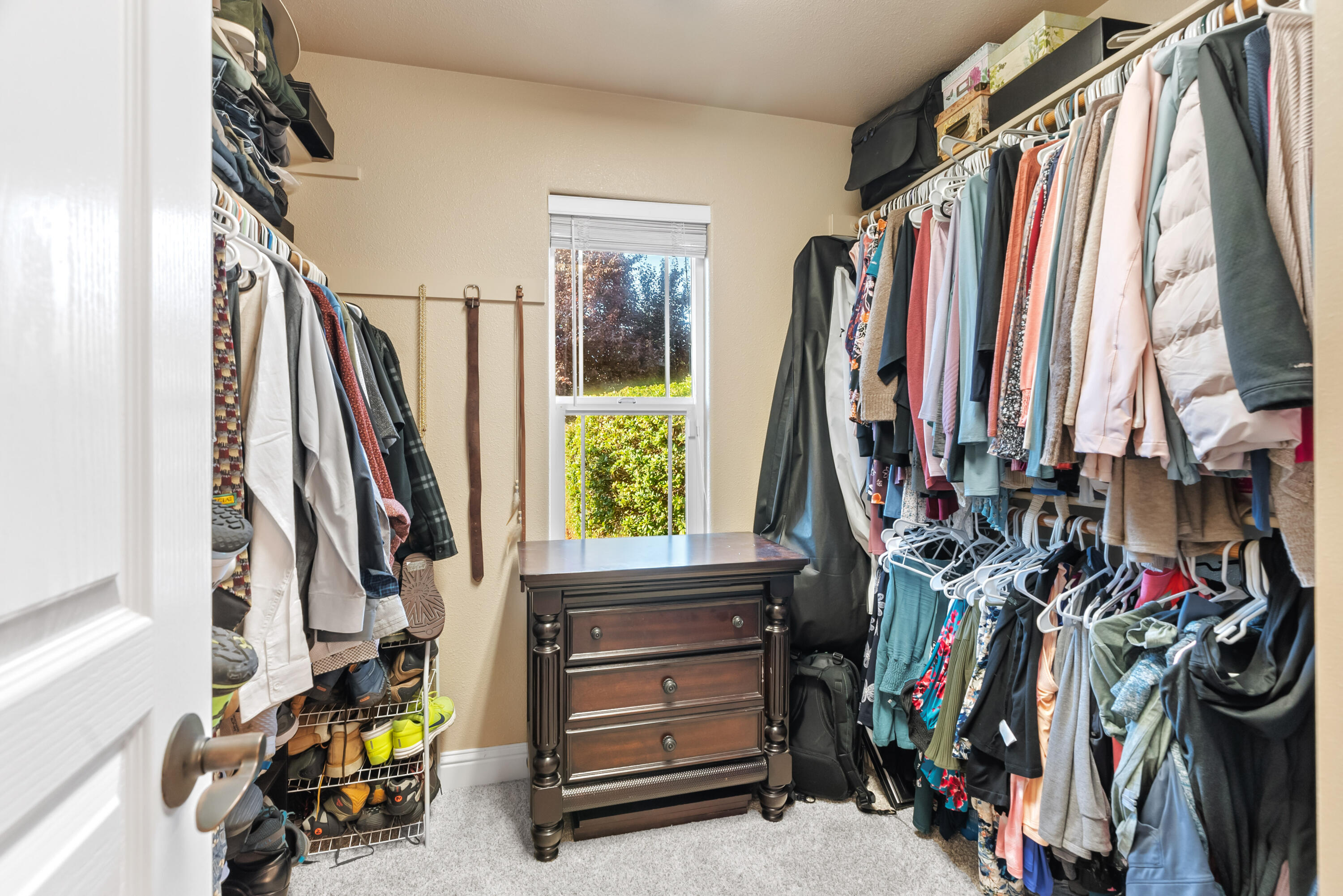 3149 Laver Street Redding, CA 96002 - Photo 24 of 40 a view of walk in closet with clothes and shoes