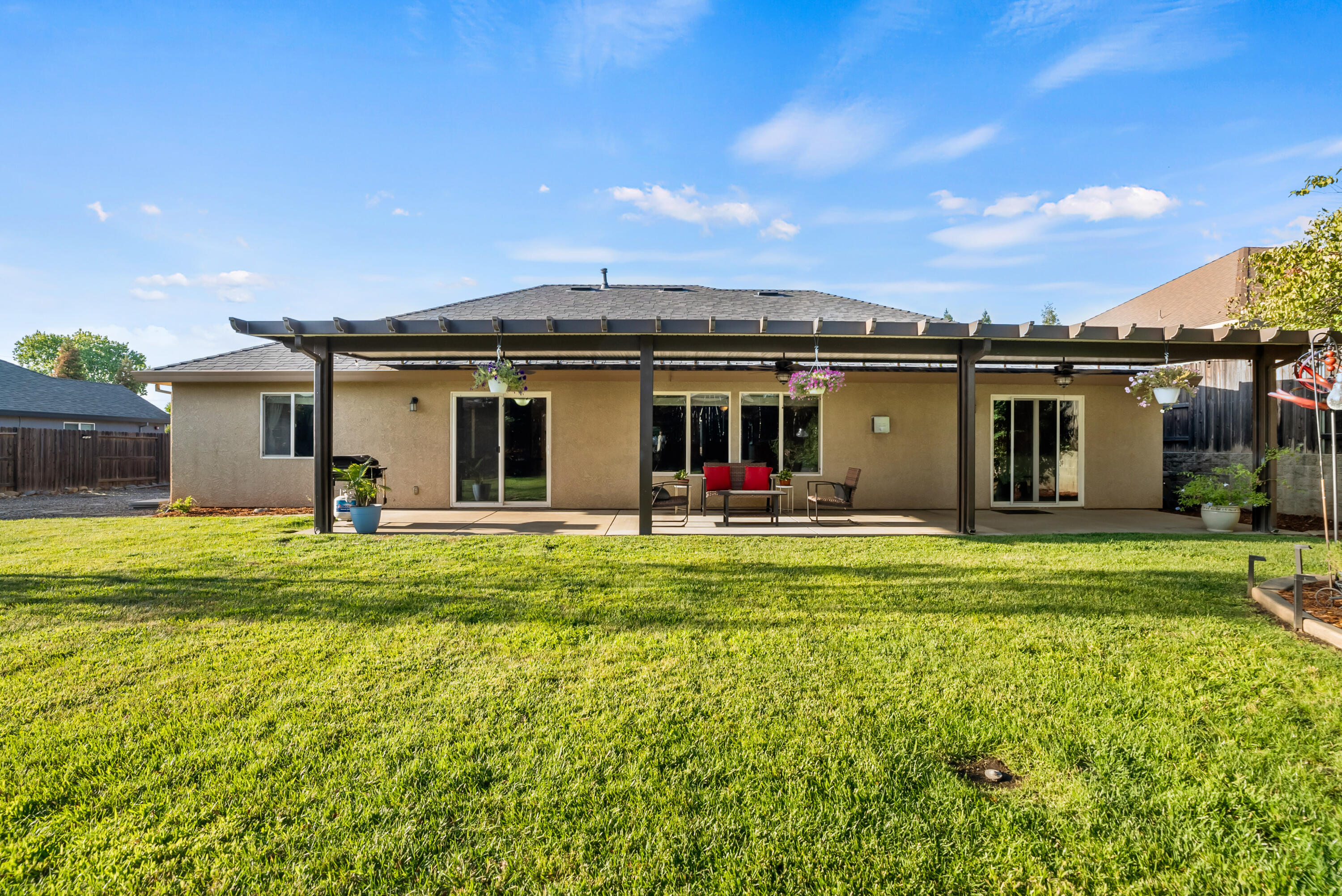 3149 Laver Street Redding, CA 96002 - Photo 36 of 40 a view of a house with a backyard