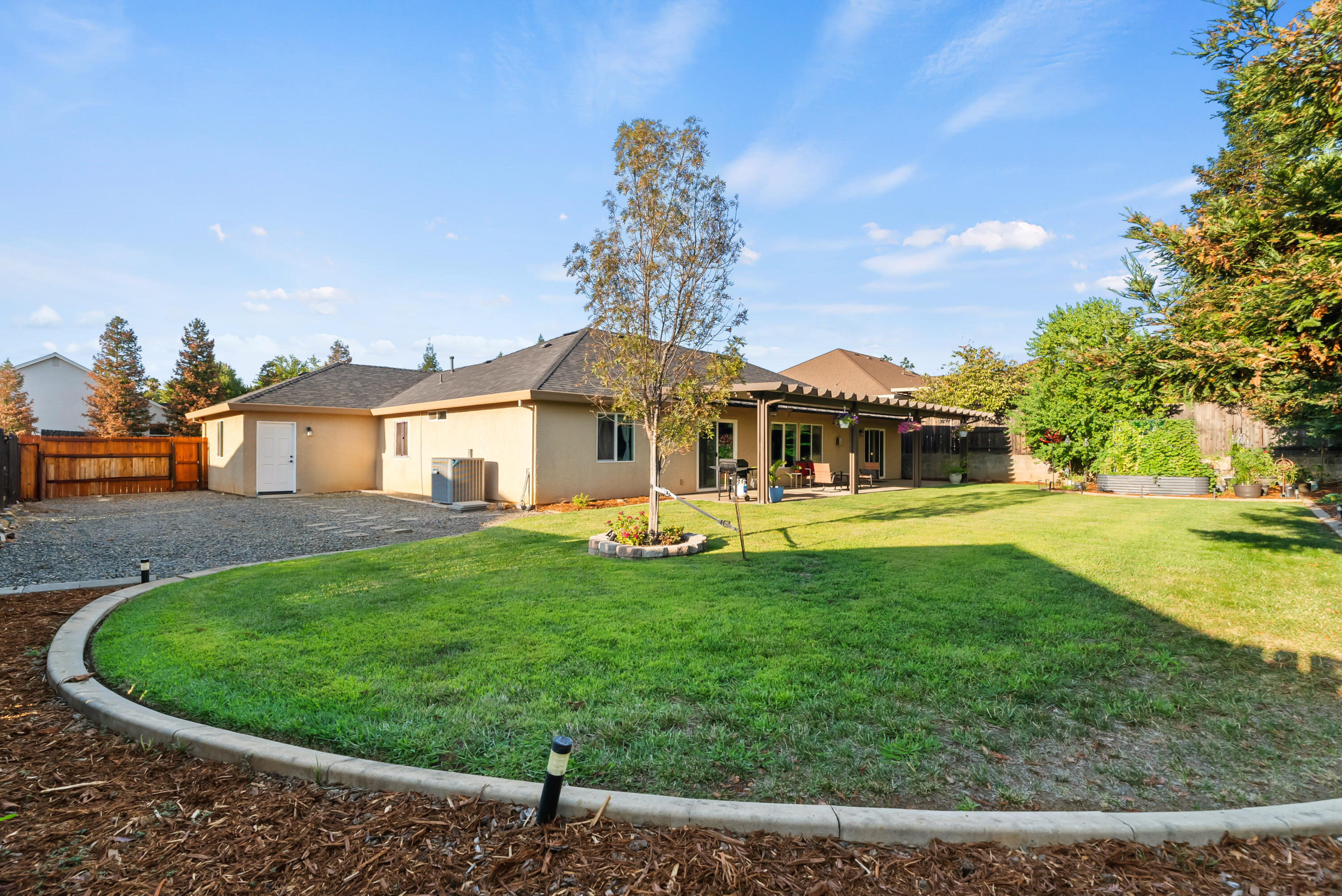 3149 Laver Street Redding, CA 96002 - Photo 40 of 40 a view of a house with a backyard