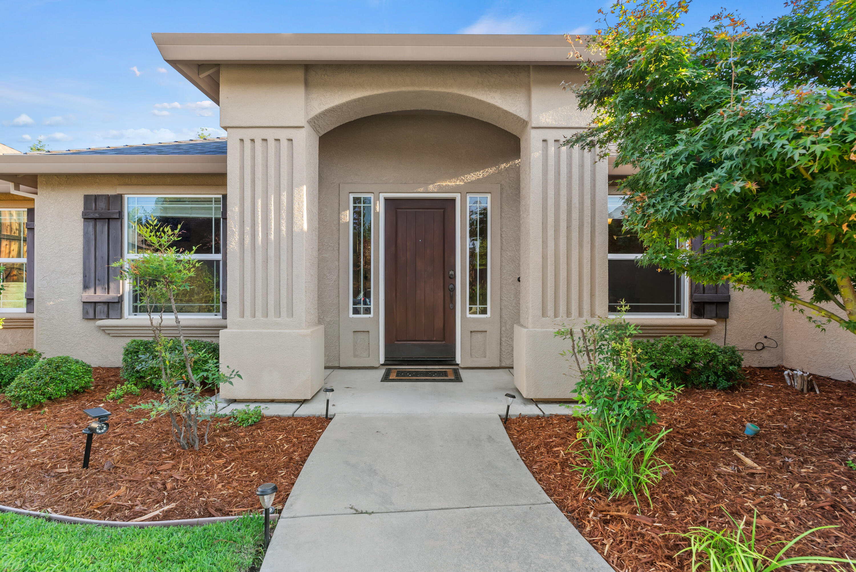 3149 Laver Street Redding, CA 96002 - Photo 4 of 40 a front view of a house with garden
