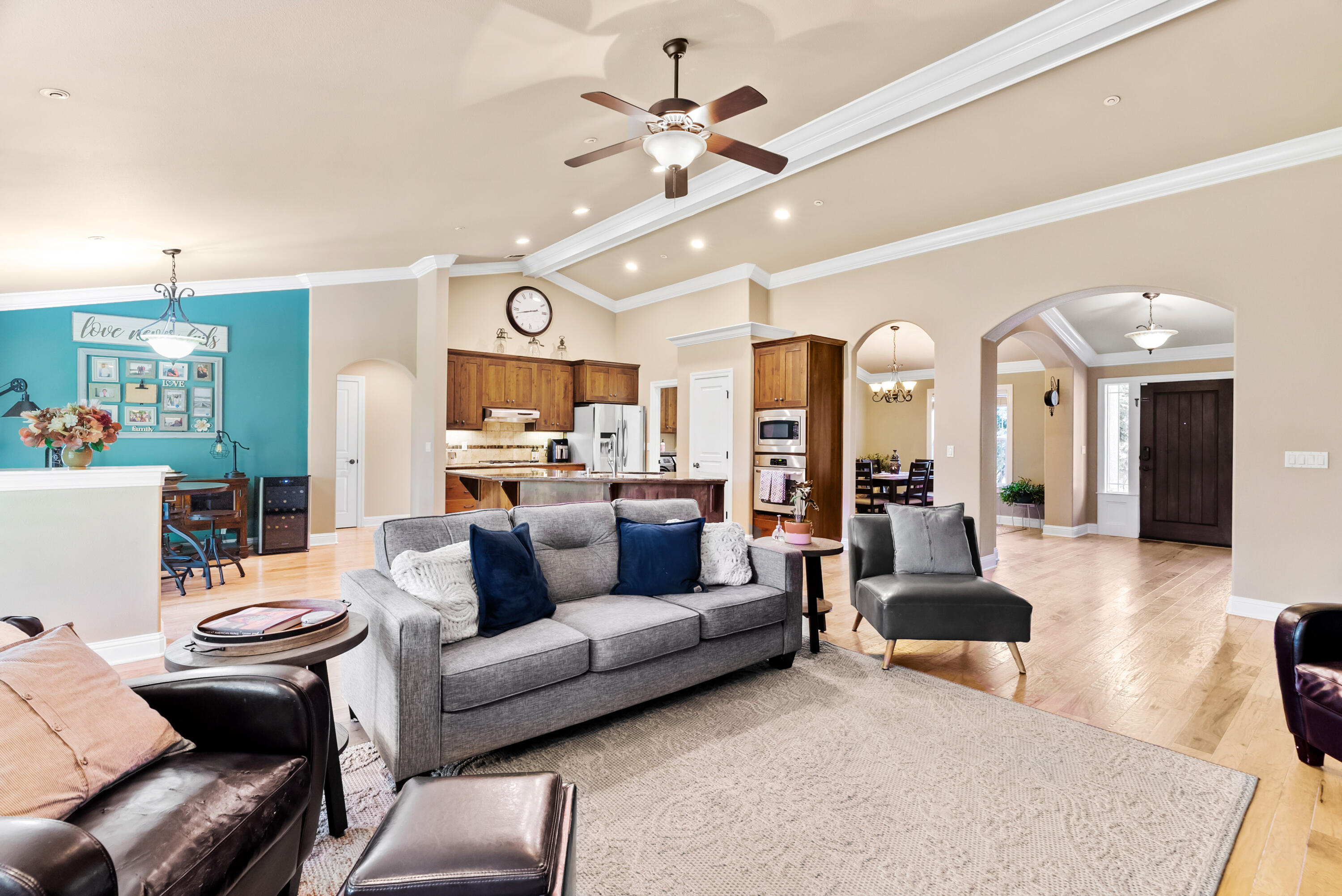 3149 Laver Street Redding, CA 96002 - Photo 10 of 40 a living room with furniture kitchen view and a chandelier