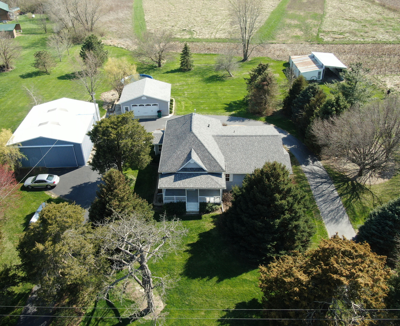 8792 Texas Church Road Clinton, IL 61727 - Photo 2 of 29 an aerial view of a house with a yard