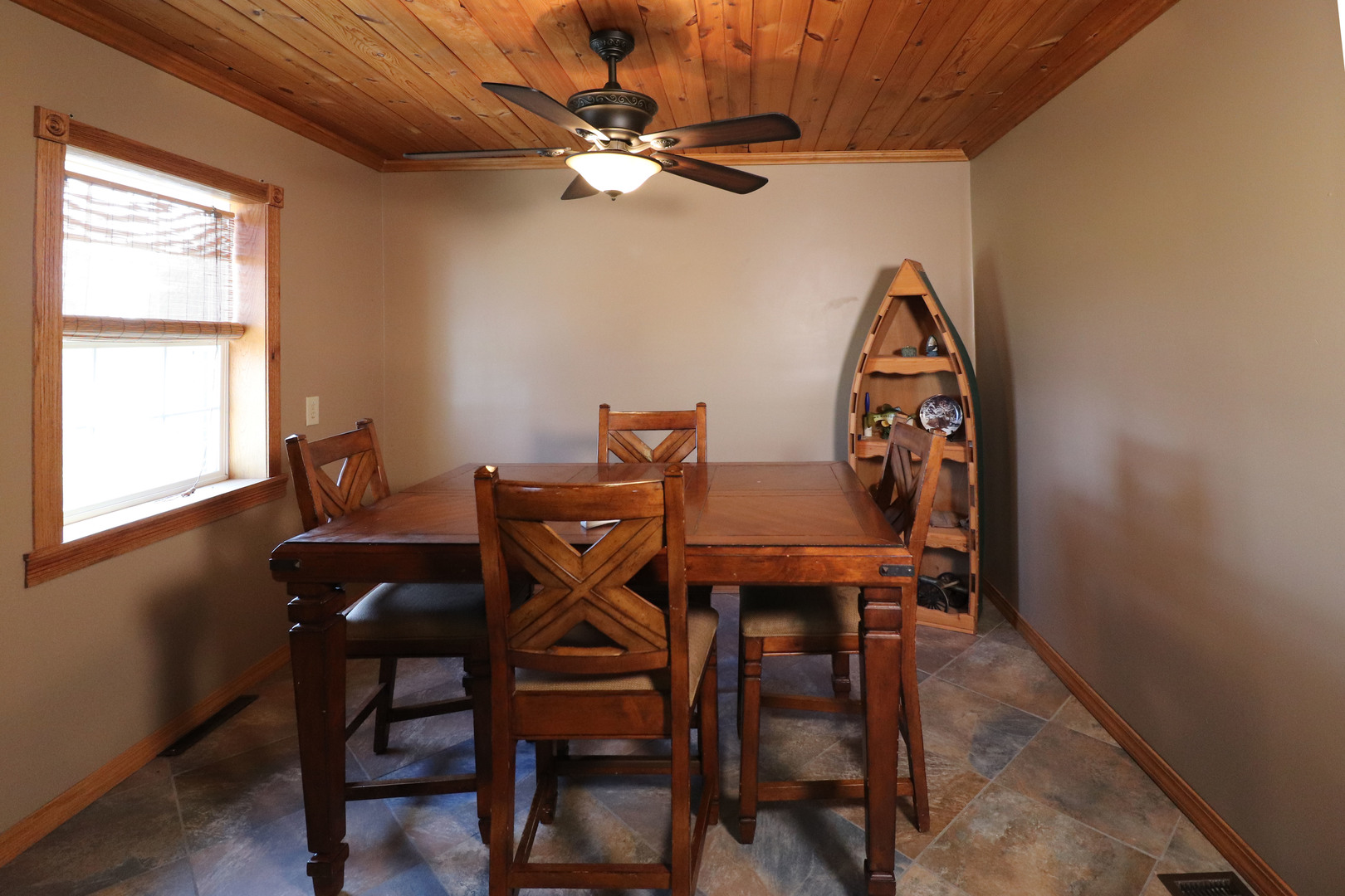 8792 Texas Church Road Clinton, IL 61727 - Photo 14 of 29 a view of a dining room with furniture and a chandelier