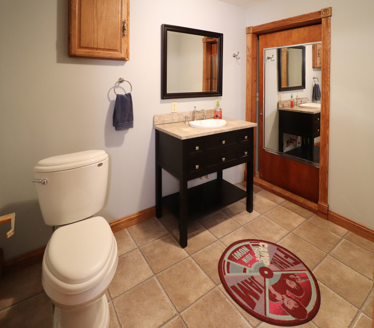 8792 Texas Church Road Clinton, IL 61727 - Photo 28 of 29 a bathroom with a toilet a sink and mirror