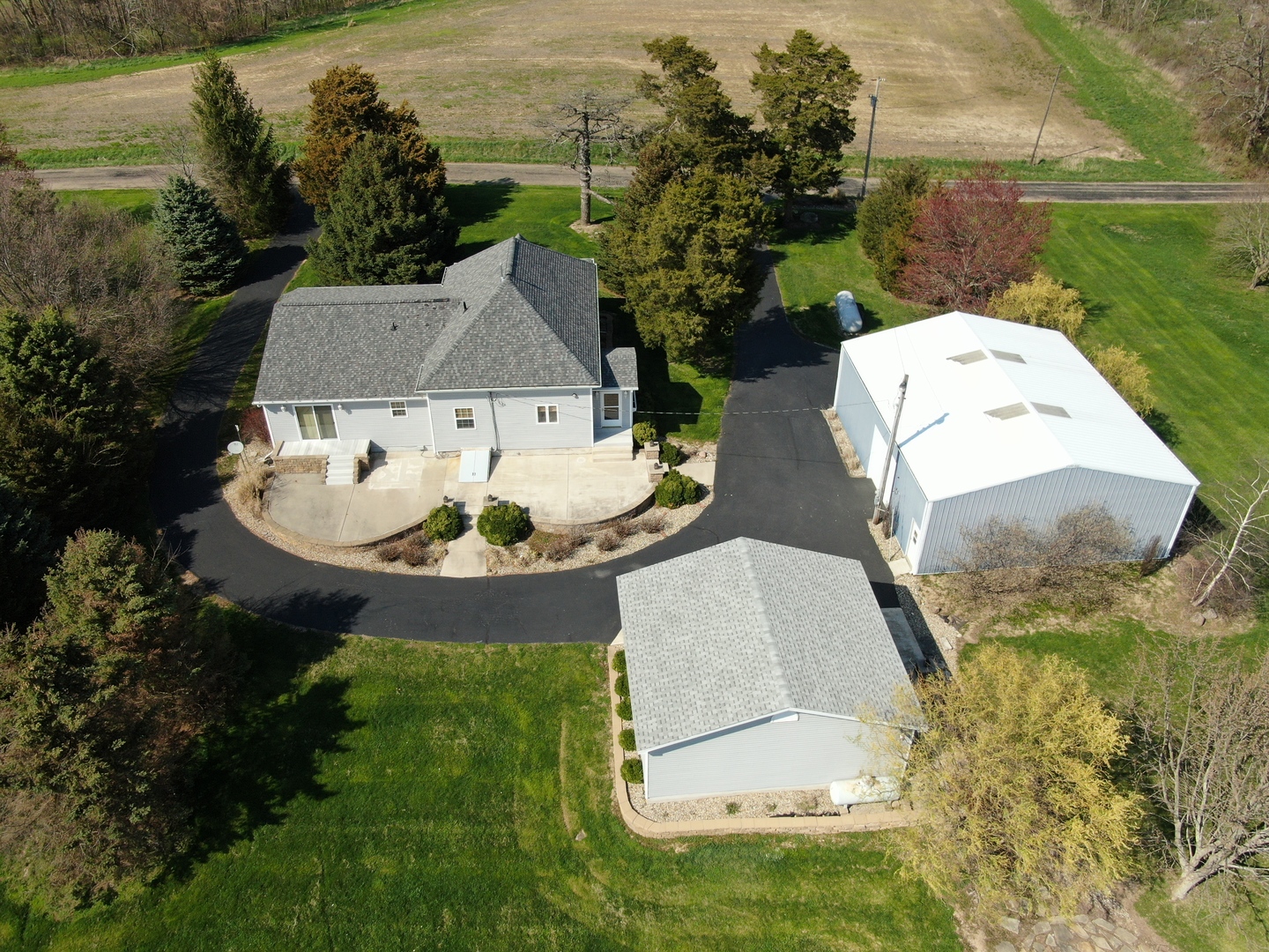 8792 Texas Church Road Clinton, IL 61727 - Photo 4 of 29 an aerial view of a house with outdoor space and swimming pool