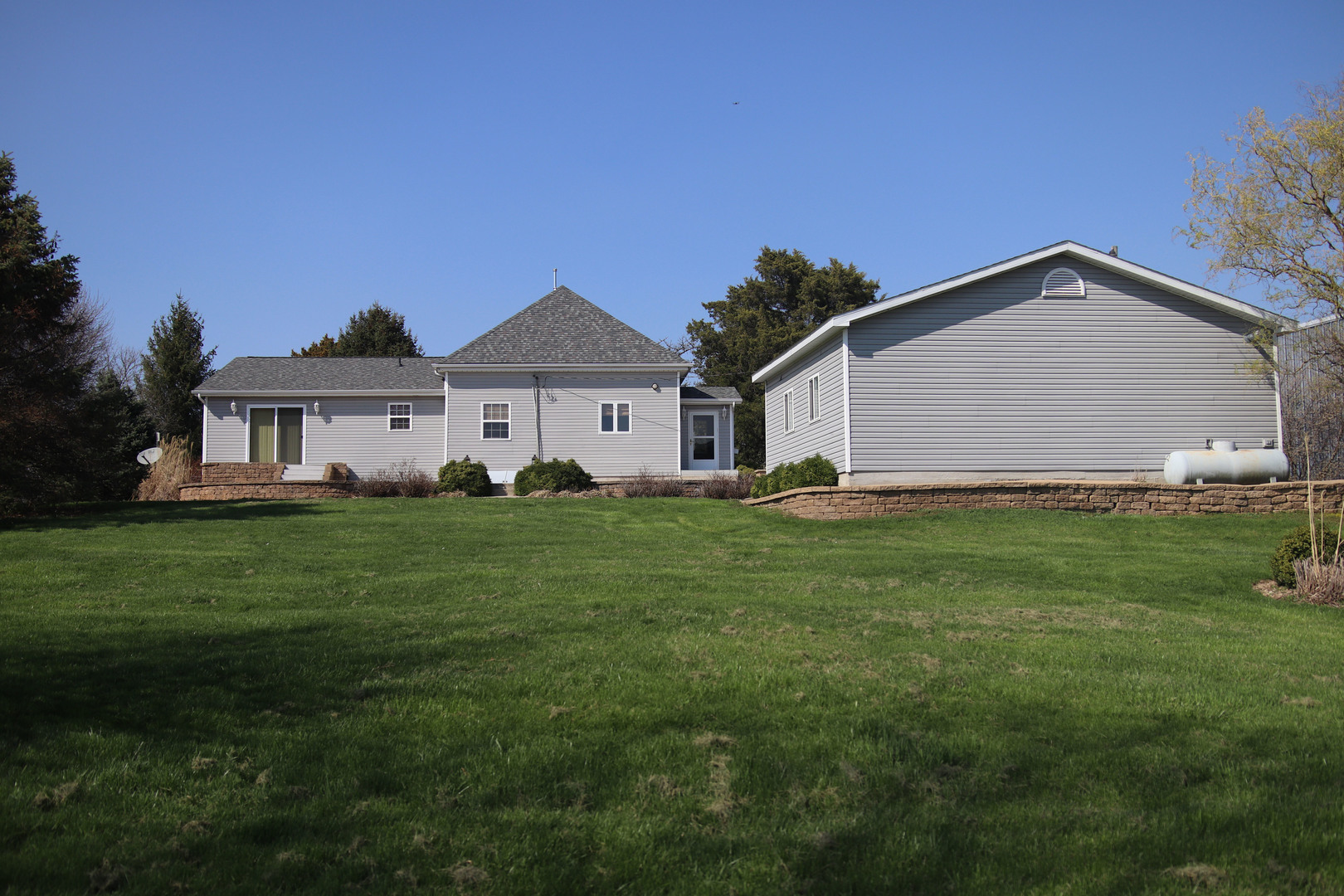 8792 Texas Church Road Clinton, IL 61727 - Photo 6 of 29 a aerial view of a house next to a big yard and large trees