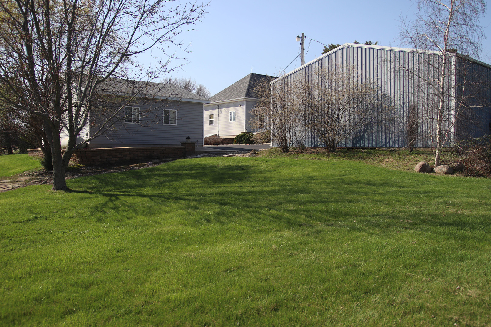 8792 Texas Church Road Clinton, IL 61727 - Photo 7 of 29 a house view with a garden space