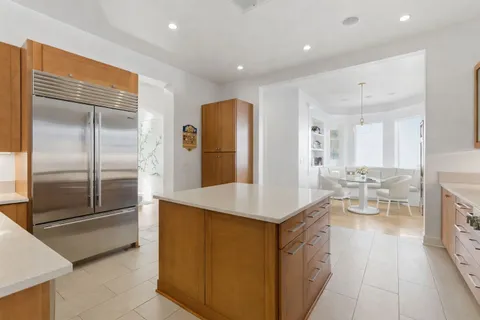 a kitchen with counter top space and refrigerator