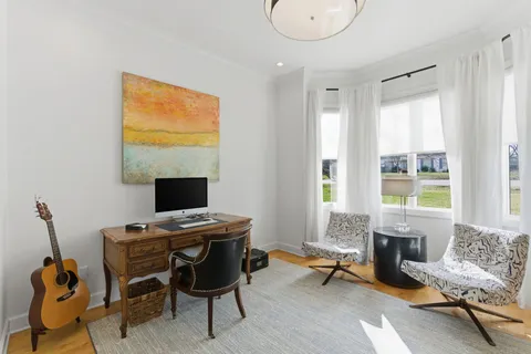 a workspace with furniture and a window