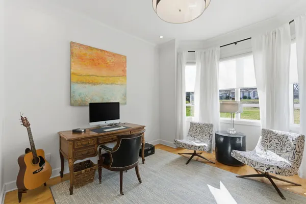 a workspace with furniture and a window