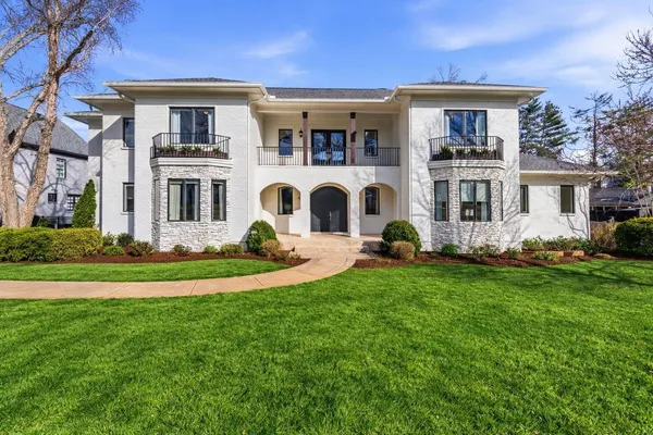 a front view of a house with a yard
